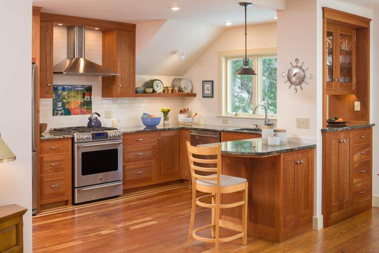 Kitchen with wood flooring and cabinets