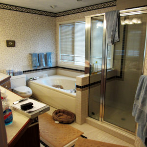 cluttered bathroom scene with a tub and shower