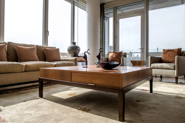 view of a NYC apartment from the floor looking up at a coffee table
