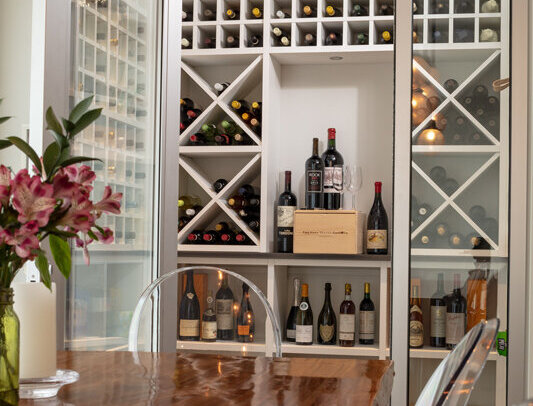 large wooden table and a wine room